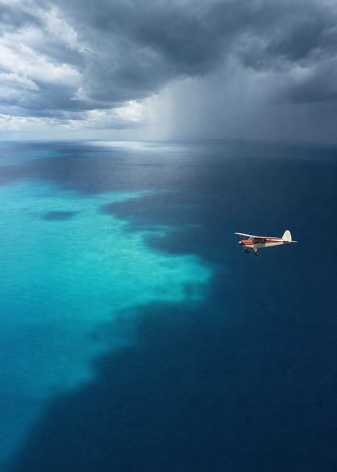 Vintage Plane over a Turquoise Tropical Sea