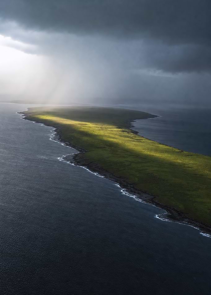 Emerald Peninsula under Stormy Coastal Light
