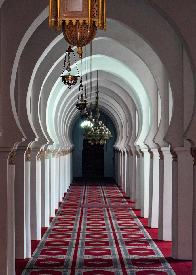 Ornate Mosque Corridor with Hanging Lanterns