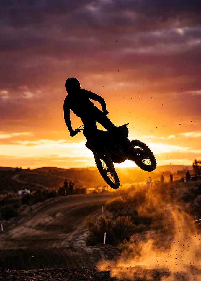 Motocross Rider Jumping at Sunset