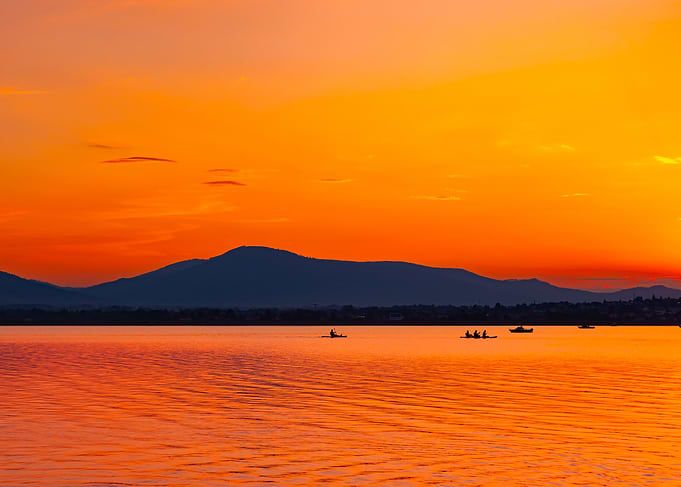 Vibrant Orange Sunset Over Lake