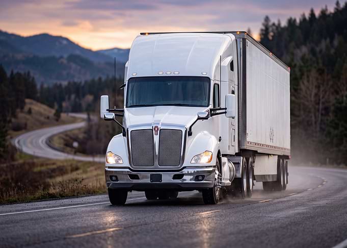 White Semi Truck on Mountain Road