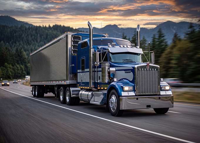 Blue Kenworth Semi Truck on Highway