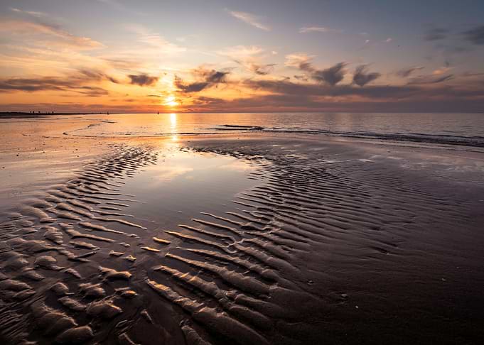 Golden Sunset Over Tidal Beach