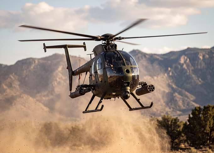 Military Little Bird Helicopter in Flight