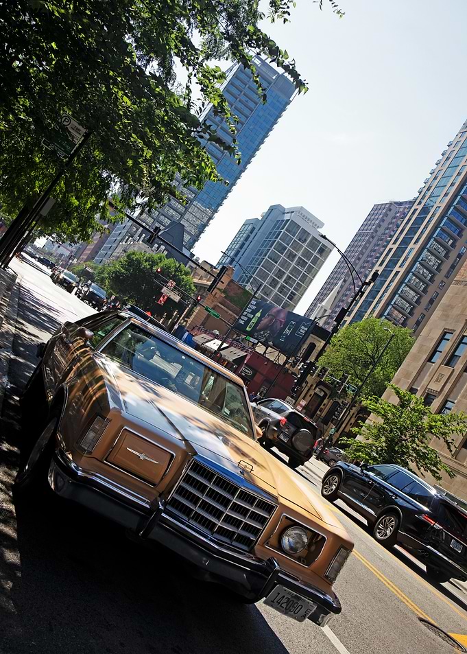 Vintage Gold Car in Cityscape