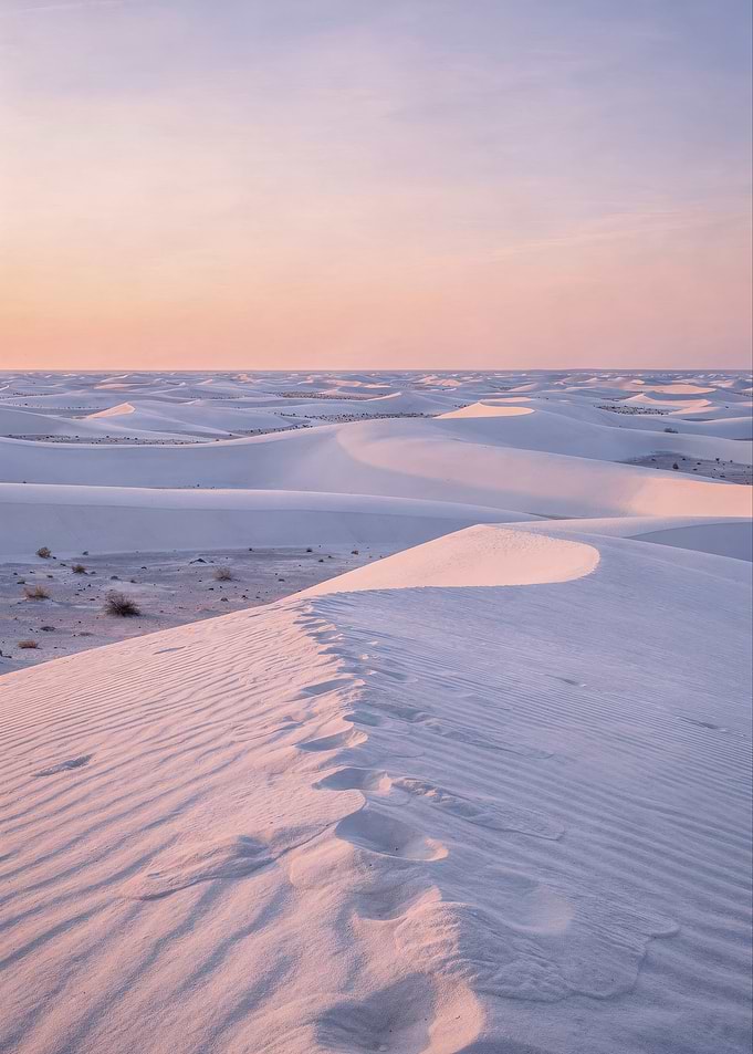 Footprints on White Sand Dunes