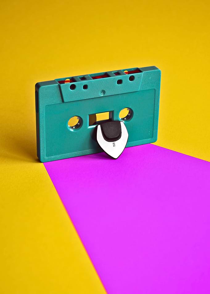 Teal Cassette Tape and Guitar Pick