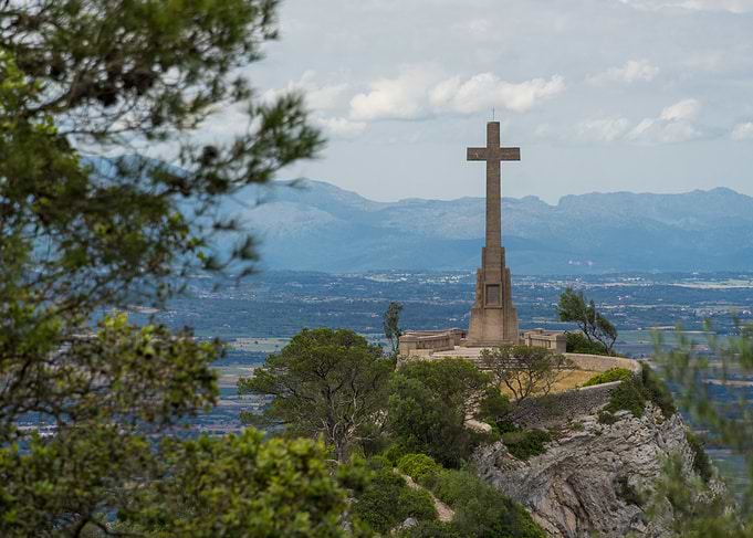 Stone Cross Monument on Mountain Peak