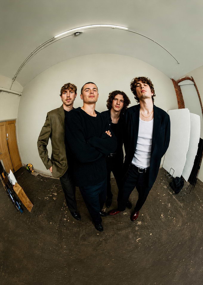 Four Young Men in Stylish Attire