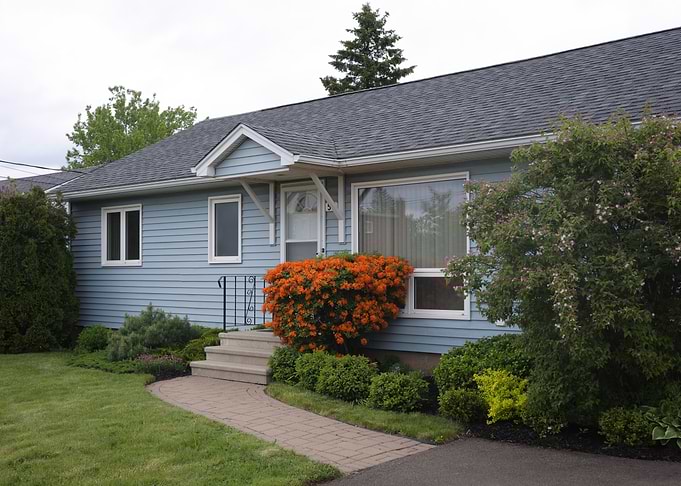 Charming Blue House with Orange Azaleas