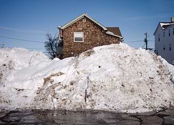 Massive Snow Pile Against House