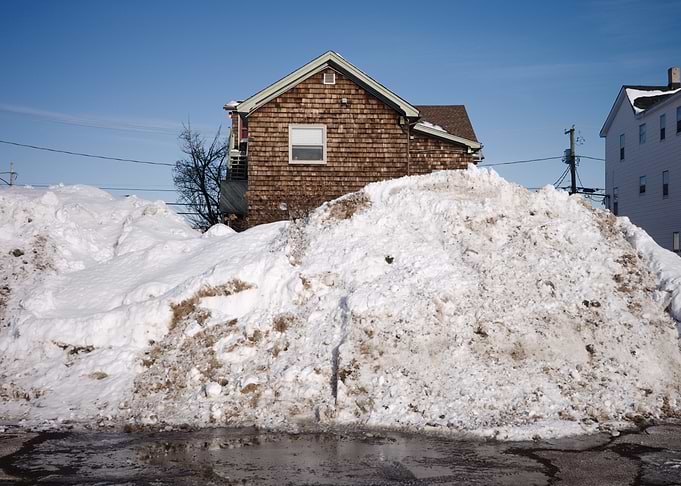 Massive Snow Pile Against House