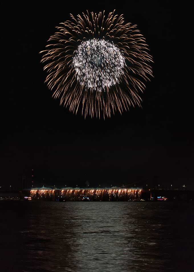 Fireworks Display Over Bridge at Night