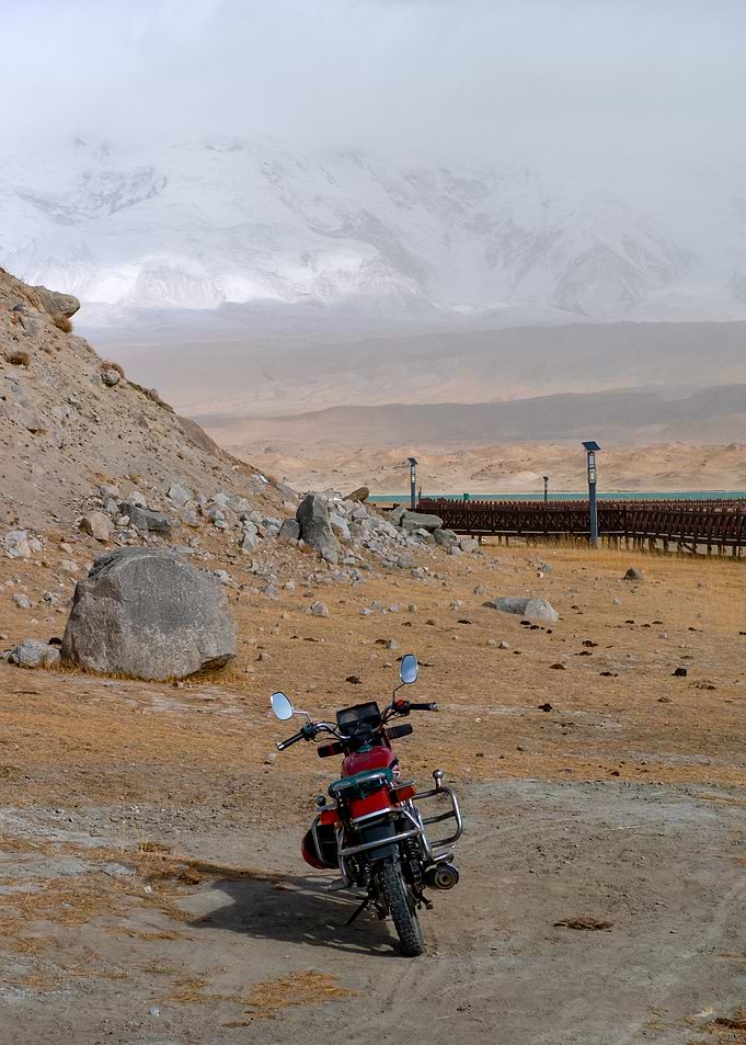 Red Motorcycle in Mountain Landscape
