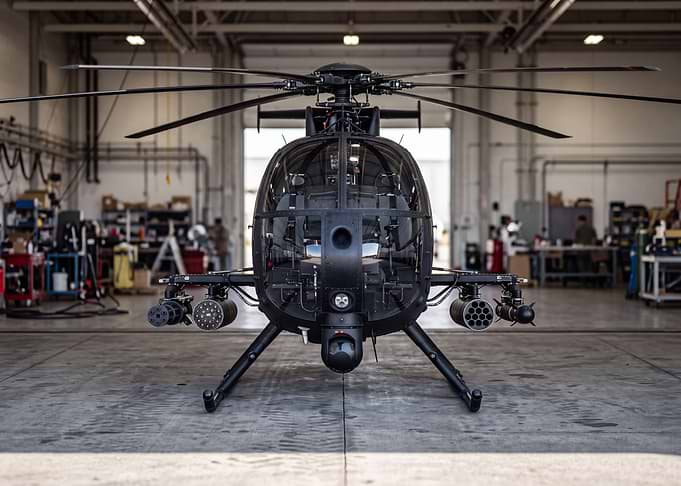 Black Military Attack Helicopter in Hangar