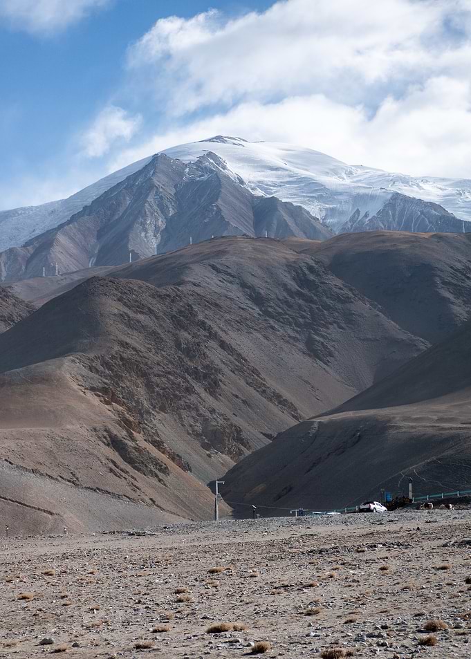 Snow-Capped Mountain Peak in Desert Landscape