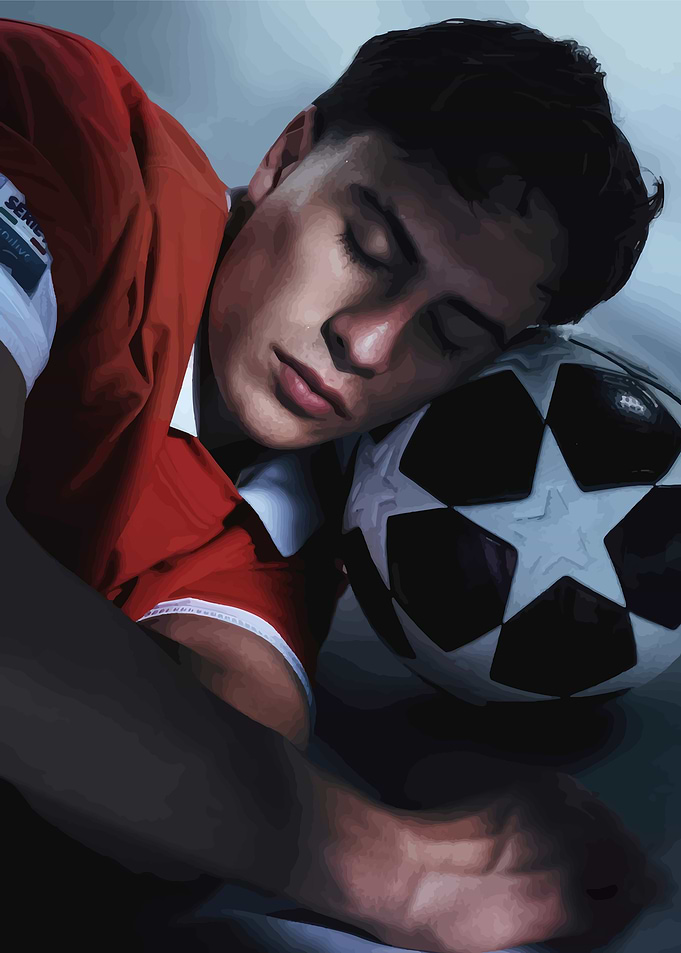 Young Soccer Player Resting on Ball