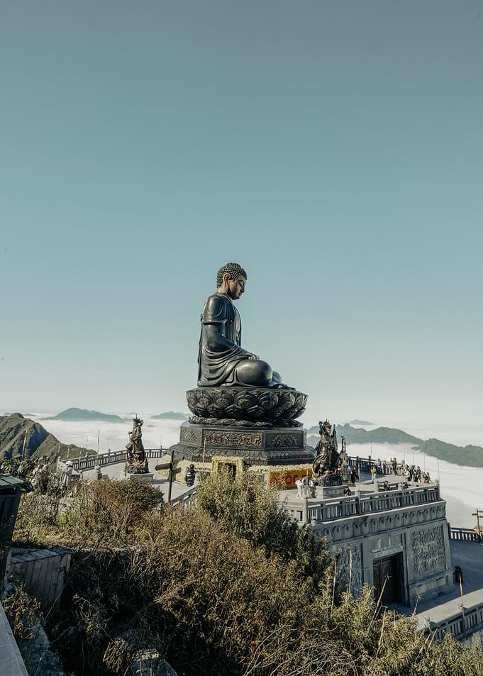 Giant Buddha Statue Above Clouds