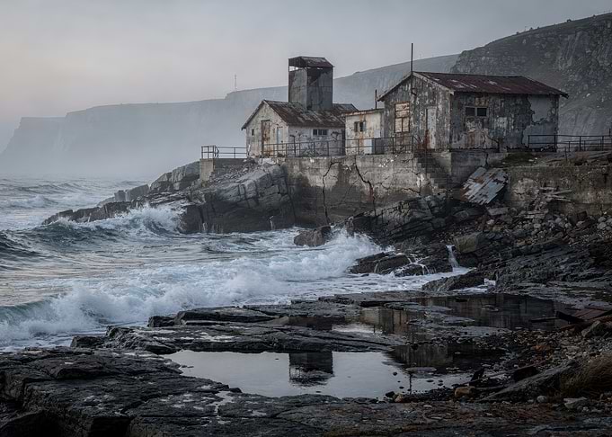 Abandoned Coastal Buildings in Fog