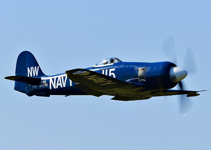 Vintage Navy Fighter Plane in Flight
