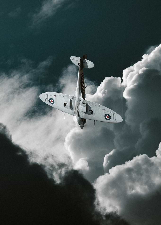 Supermarine Spitfire Flying Through Clouds