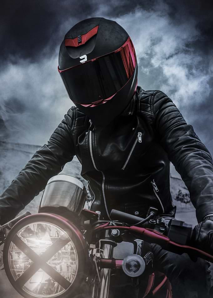 Biker in Leather Jacket and Helmet