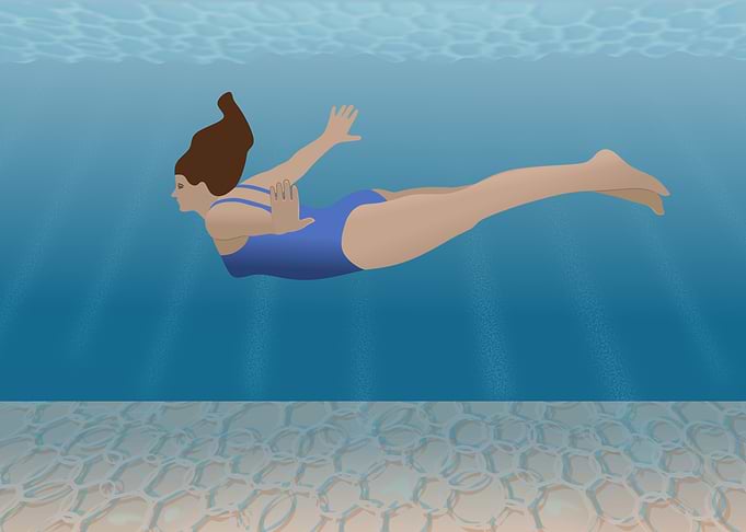 Woman Swimming Underwater