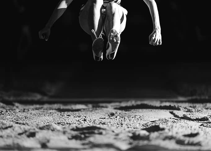 Long Jump Athlete in Mid-Air
