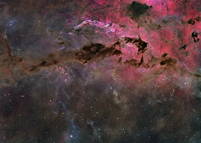 Vibrant Nebula and Dark Dust Clouds