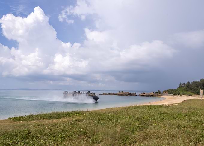 Military Hovercraft Landing on Beach
