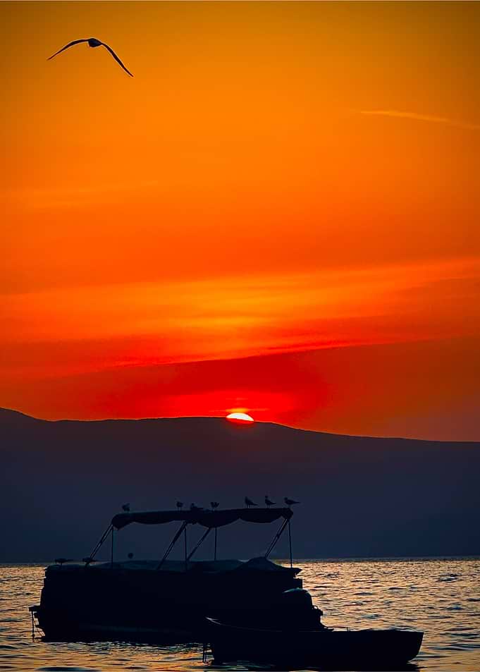 Sunset Over Water with Boats