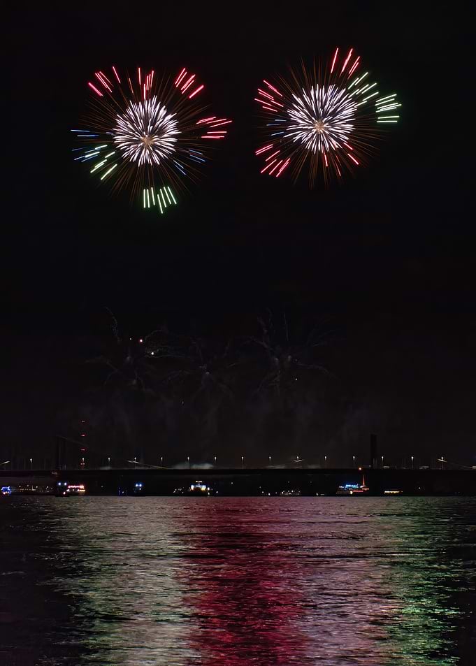 Fireworks Over Water at Night