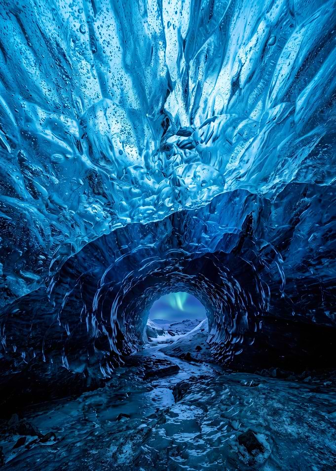 Ice Cave with Northern Lights View
