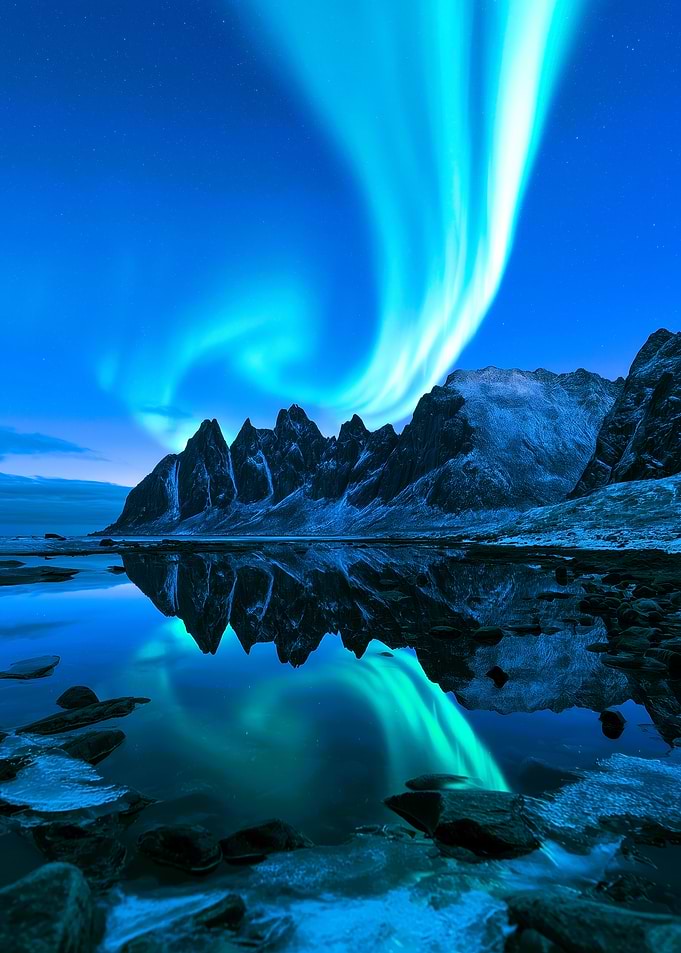 Aurora Borealis Over Jagged Mountains