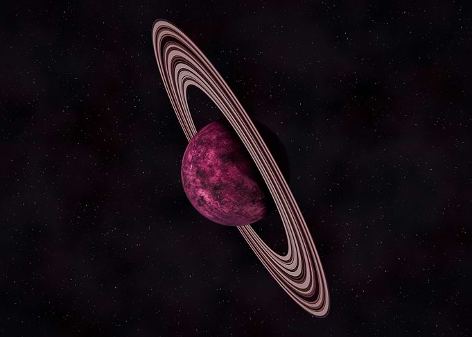 Pink Ringed Planet in Space