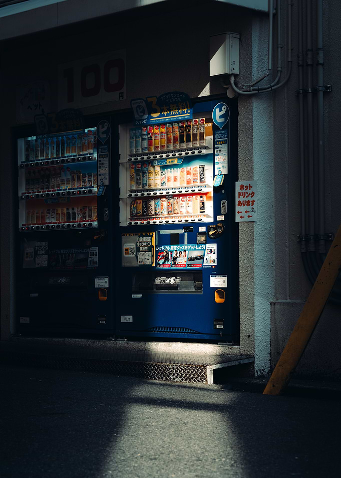 Illuminated Japanese Vending Machines at Night
