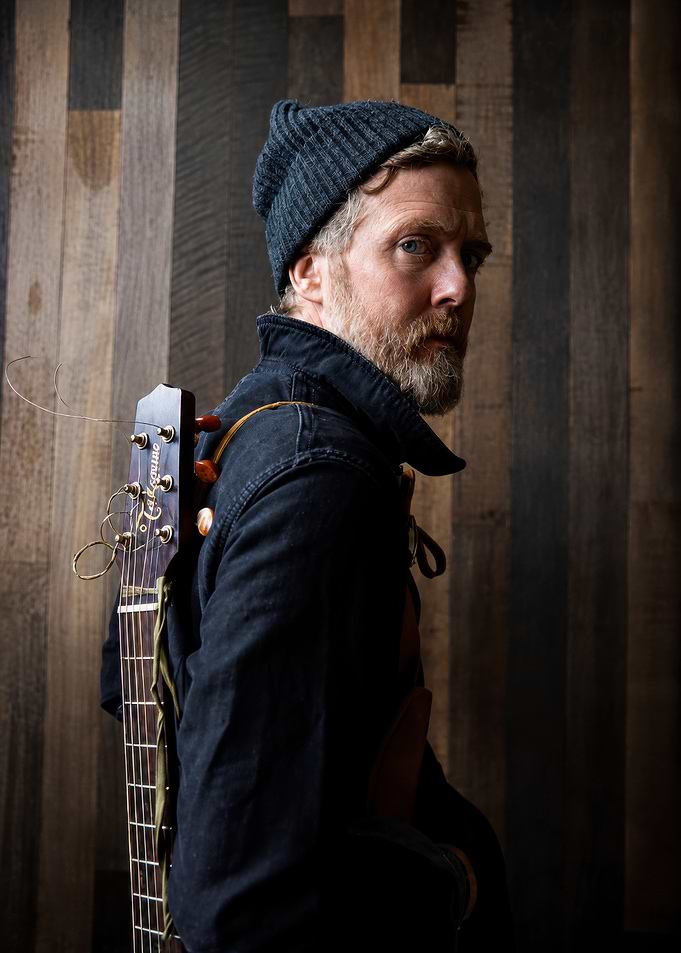 Musician with Guitar and Beanie
