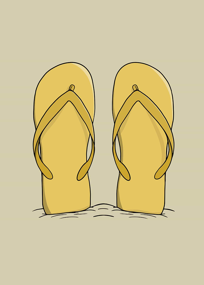 Yellow Flip Flops on Sand