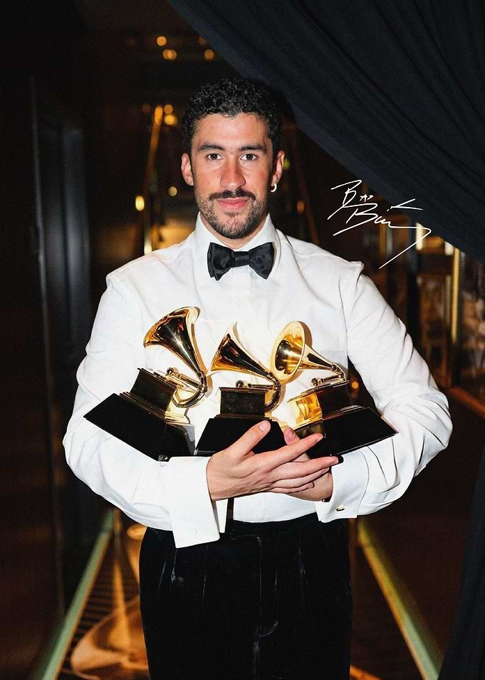 Bad Bunny Holding Three Grammy Awards