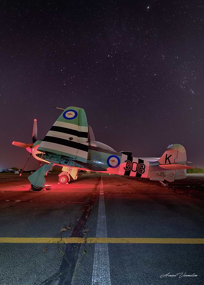 Vintage Military Aircraft Under Starry Sky
