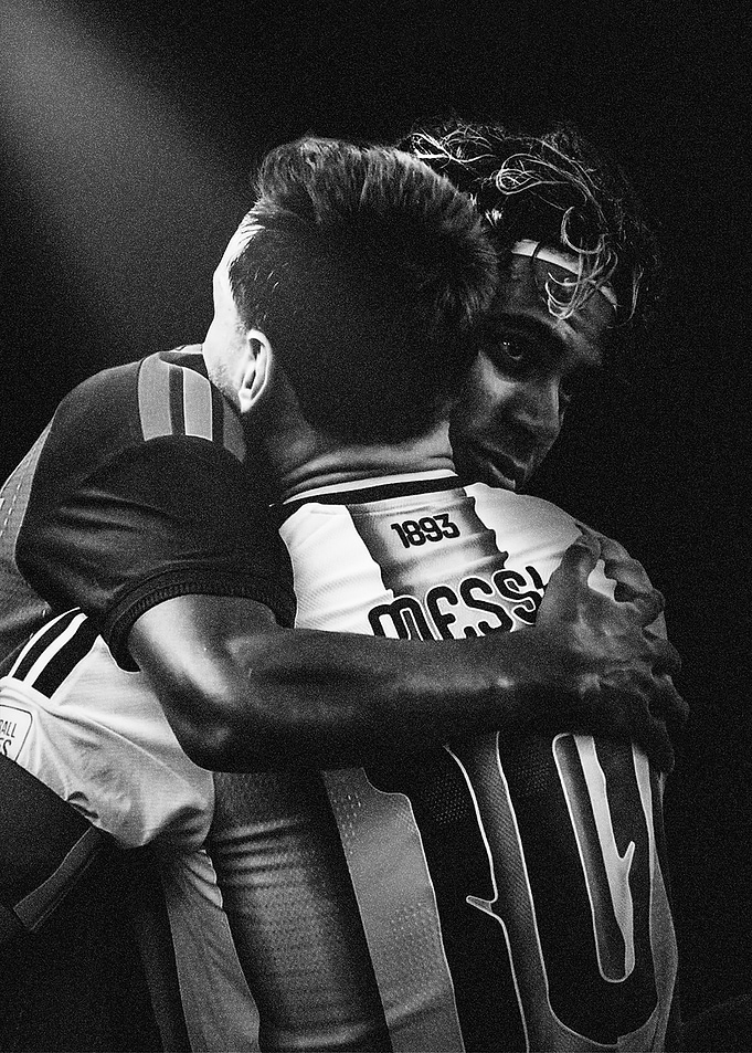 Lionel Messi Embracing a Teammate