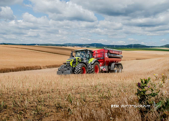 Claas Tractor Harvesting in Wheat Field