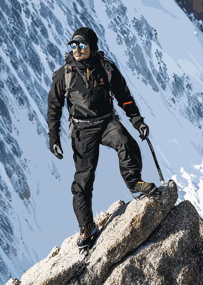 Mountaineer Standing on Snowy Peak