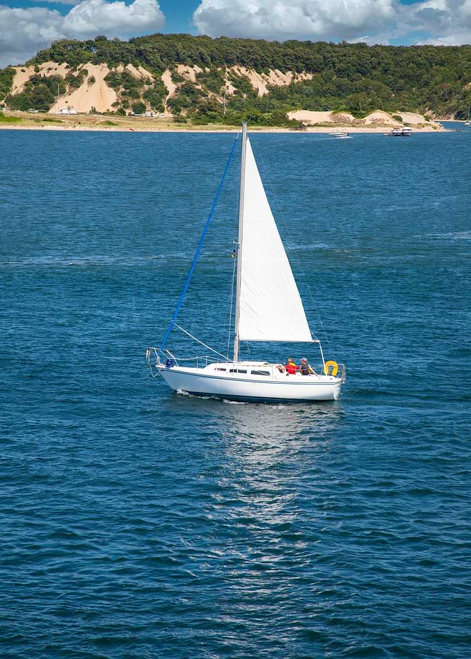 Sailboat Sailing on Blue Water