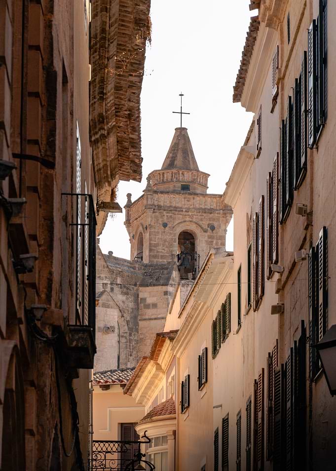 Narrow European Street with Church Tower