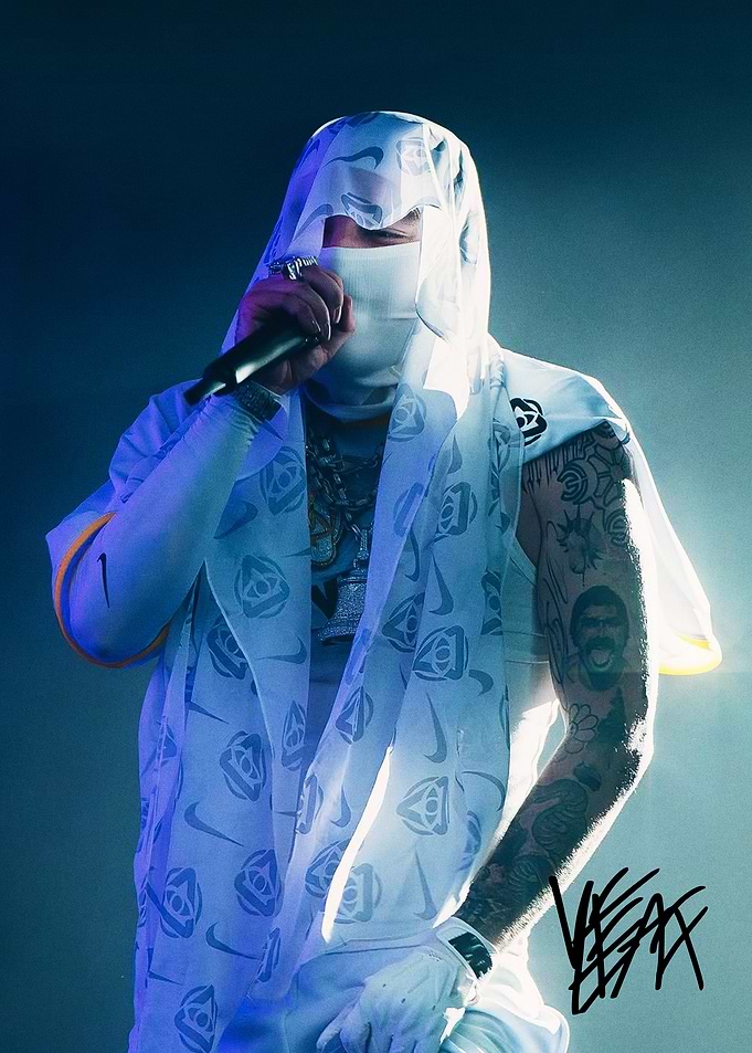 Yeat performing in white mask