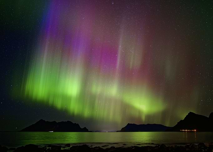 Vibrant Aurora Borealis Over Coastal Mountains