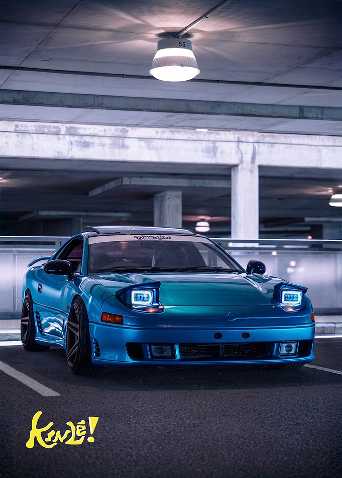 Modified Blue car in parking lot