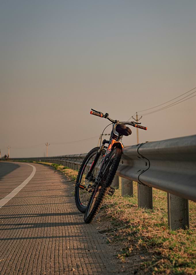 Mountain bike parked on highway guardrail